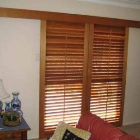 Alan's shutters are made of Western Red Cedar and they have been oiled to preserve the natural timber making it look warm and beautiful. These shutters are Western Red Cedar on tracks with a matching pelmet creating a lovely feature doorway while still keeping the intial privacy. The end result is stunning!