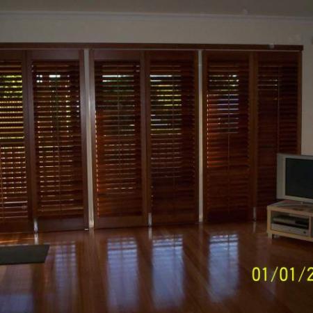 Living room shutters made out of Cedar give a warm and rich feeling to the room. Western Red Cedar can soften the feeling of any room in any house. Sliding Bi-fold Western Red Cedar shutters are designed so you have control of the light and air flow in your home; perfect for brightening up the room or making the perfect home theatre.  