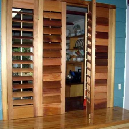 Rod's shutters are practical as well as beautiful. His Western Red Cedar Shutters are oiled and hinged to create easy access from the kitchen. The oil stain enhances the natural features of the timber thus creating stunning feature, fixing the 