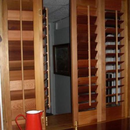 Rod's shutters are practical as well as beautiful. His Western Red Cedar Shutters are oiled and hinged to create easy access from the kitchen. The oil stain enhances the natural features of the timber thus creating stunning feature, fixing the 