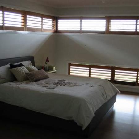 Lisa has a number of windows that are long and skinny; without Plantation shutters they would be difficult to block the sunlight. Plantation shutters assembled as double shutters were an ideal solution for this type of window. Shutterkits can find the solution for any oddly shaped window. 