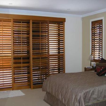 Internal Plantation Shutters built to slide across sliding glass doors. No matter what shape the window ShutterKits can build a shutter to fit it. Julie and Roy's house is totally fitted out with Western Red Cedar Plantation Shutters. The sliding plantation shutters have created easy access and privacy across the glass doors.  