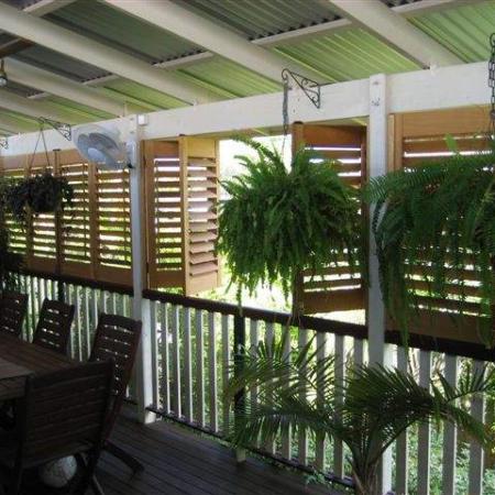 The Western Redd Cedar Plantation Shutters enclose Jakko's classic Queensland veranda. They all bi-fold back so that Jakko can open up the area entirely. Jakko has testified, 