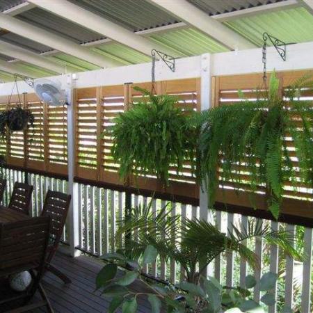 The Western Redd Cedar Plantation Shutters enclose Jakko's classic Queensland veranda, bringing a privacy from the neighbours. They all bi-fold back so that Jakko can open up the area entirely. Jakko has testified, 